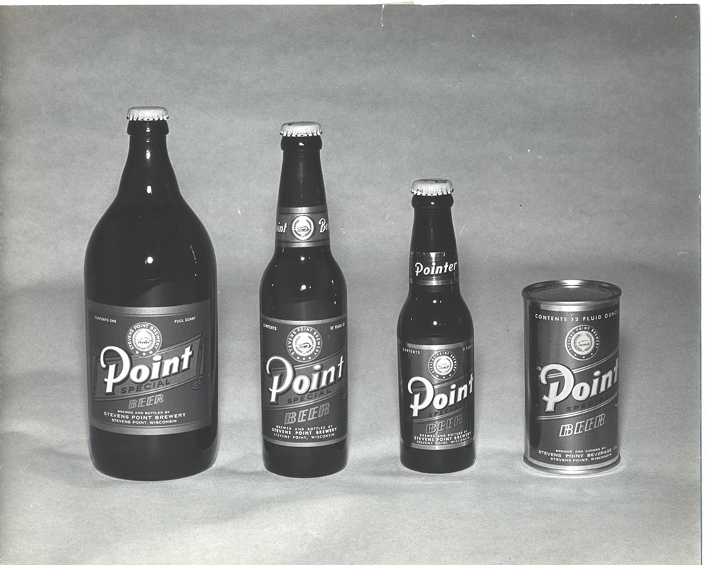 Vintage bottles and cans of Point Special beer