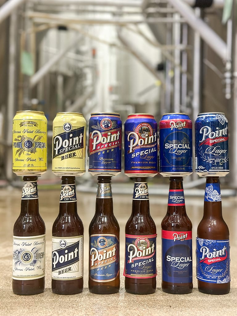 Vintage cans and bottles of Point Special displayed in the brewery