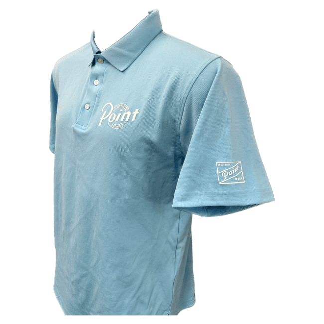 Side view of the men's fit golf polo in light blue. On the left chest area, the Point Brewery logo is screen-printed in white. On one of the sleeves, the words "Drink Point Beer," are screen-printed in white.